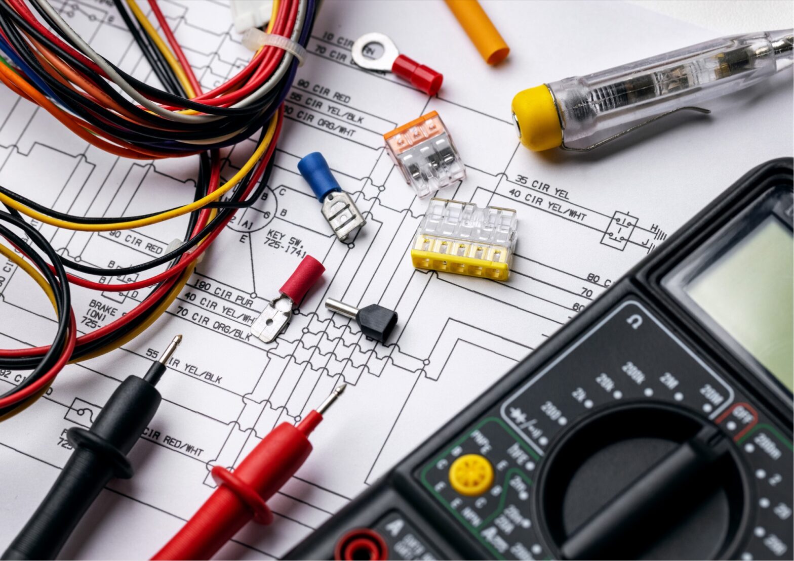 Electrician wiring tools, connectors, and a multimeter on an electrical schematic, Golden Electrical serving Danville, CA
