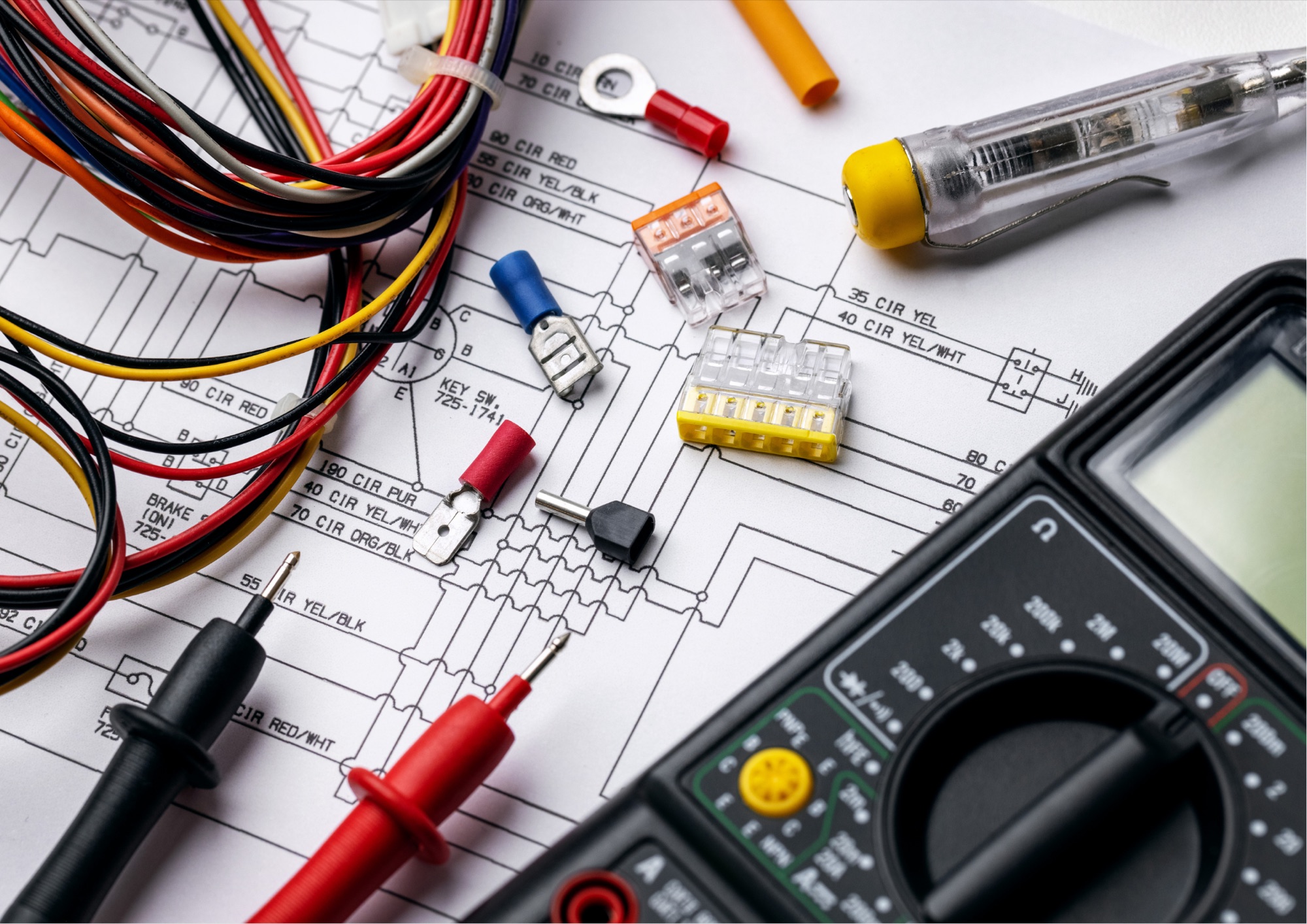 Electrician wiring tools, connectors, and a multimeter on an electrical schematic, Golden Electrical serving Danville, CA